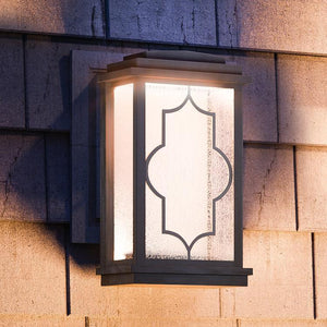 A unique luxury lighting fixture, the Urban Ambiance UHP1200 Rectangular Outdoor Wall Light with a Bronze Finish, Luton Collection, adds elegance to the side of a house.