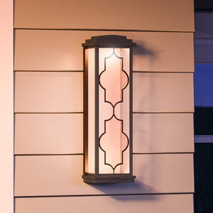 An Architectural Bronze Finish lighting fixture from the Luton Collection on the side of a house.