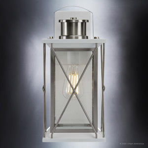 A unique lighting fixture, the Urban Ambiance UHP1223 Colonial Outdoor Wall Light features a glass shade and exudes a sense of luxury.