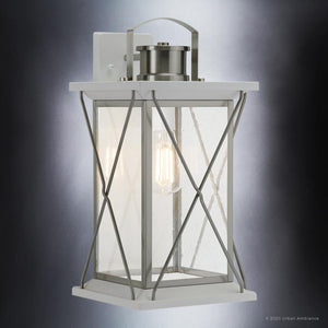 A luxurious UHP1224 Colonial Outdoor Wall Light with a gorgeous clear glass shade by Urban Ambiance.