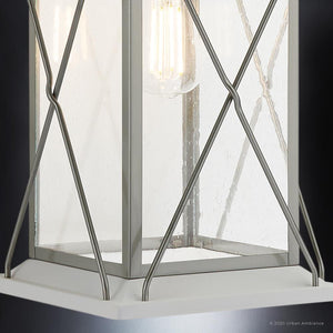 A beautiful UHP1224 Colonial Outdoor Wall Light from Urban Ambiance, with a glass shade.