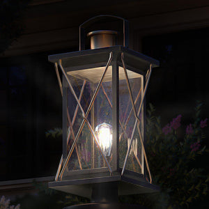 A beautiful UHP1230 Colonial Outdoor Post/Pier Light, 20"H x 9"W, in Olde Bronze Finish from the Luxury Longmont Collection by Urban Ambiance adorns a lamp