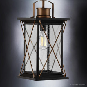 A Unique Outdoor Pendant Light with a clear glass shade, part of the Longmont Collection, featuring an Olde Bronze Finish.