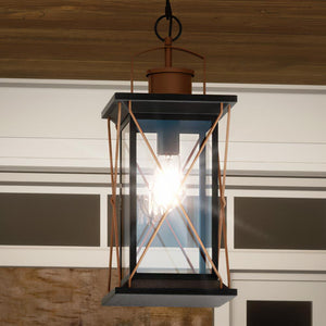 An Urban Ambiance UHP1231 Colonial Outdoor Pendant Light, 21"H x 9"W, Olde Bronze Finish, Longmont Collection hanging from the ceiling of a house, creating a beautiful