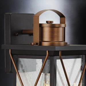 A unique lighting fixture, the Urban Ambiance Colonial Outdoor Wall Light features a glass shade and an Olde Bronze Finish.
