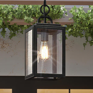 A gorgeous, modern outdoor pendant lamp from the Macon Collection hanging from a porch.