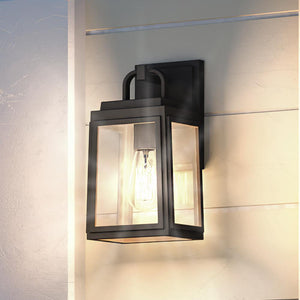 A unique UHP1242 Modern Outdoor Wall Light, 11.875"H x 5.5"W, Midnight Black Finish from Urban Ambiance on a white wall.
