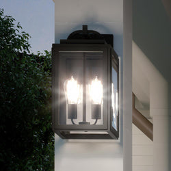 A unique lighting fixture, the UHP1244 Modern Outdoor Wall Light from the Macon Collection by Urban Ambiance enhances the aesthetic appeal of a house with its gorgeous design in Midnight Black