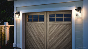 A unique wooden garage door with two beautiful UHP1262 Cosmopolitan Outdoor Wall Lights.