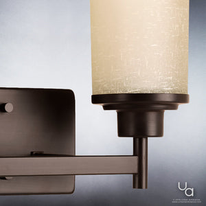 Close-up of the Urban Ambiance UHP2011 Contemporary Bathroom Vanity Light from the Cupertino Collection, featuring a rectangular base with an Olde Bronze finish and a cylindrical frosted glass shade, photographed against a neutral background—an ideal choice for those seeking contemporary vintage lighting with timeless appeal. Fixture measures 9.5″ high by 13″ wide.
