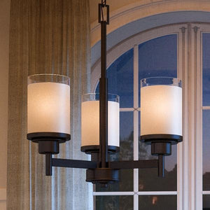 A stunning UHP2016 Contemporary Chandelier, adorned with an Olde Bronze Finish from the Cupertino Collection by Urban Ambiance, creates an exquisite lighting fixture hanging over a window in a dining room.
