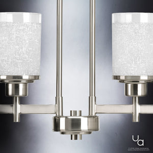 Close-up of the Urban Ambiance UHP2019 Contemporary Chandelier from the Cupertino Collection, featuring a brushed nickel finish and two frosted glass cylindrical shades, set against a gradient background.