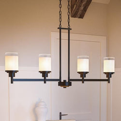 A beautiful and unique lighting fixture, the Urban Ambiance UHP2020 Contemporary Chandelier in Olde Bronze Finish from the Cupertino Collection is hung over a sink in a kitchen.