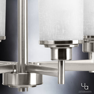 Close-up of the Urban Ambiance UHP2023 Contemporary Chandelier from the Cupertino Collection, featuring a brushed nickel finish and frosted cylindrical glass shades, set against a blurred gray background.