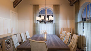 A dining room with a unique lighting fixture, the UHP2024 Contemporary Chandelier from Urban Ambiance.