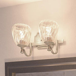 Two beautiful Crystal Bathroom Vanity Lights hanging above a mirror in a bathroom.