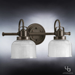 An Urban Ambiance UHP2041 Industrial Chic Bath Fixture with two glass shades, Fashion Bronze Finish, and Harlow Collection exudes a gorgeous and luxurious ambiance.