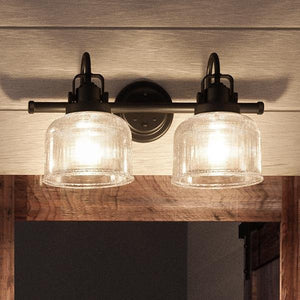 A beautiful bathroom light fixture with two glass shades.