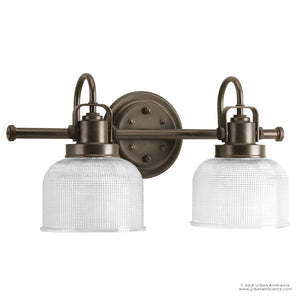 An Industrial Chic Bath Fixture with two beautiful clear glass shades.