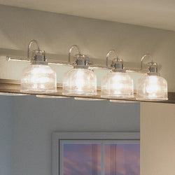 An Industrial Chic Bath Fixture with four beautiful glass shades.