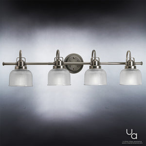 Four Urban Ambiance UHP2048 Luxe Industrial Bath Fixtures from the Harlow Collection, each measuring 8-3/4″ high by 35-1/2″ wide and finished in aged nickel, feature clear prismatic glass shades evenly spaced along a horizontal bar against a gradient gray background.