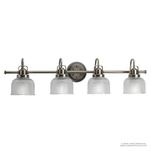 The Urban Ambiance UHP2048 Luxe Industrial Bath Fixture from the Harlow Collection is a wall-mounted piece measuring 8-3/4″ high by 35-1/2″ wide, featuring four arms in an aged nickel finish with clear prismatic glass shades, shown against a white background.
