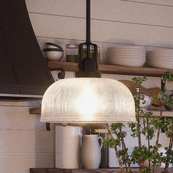 A beautiful UHP2050 Industrial Chic Pendant from the Harlow Collection by Urban Ambiance is hanging over a kitchen counter.