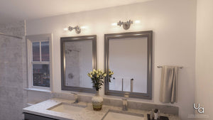 A beautiful bathroom with two UHP2061 Industrial Chic Chic Bathroom Vanity Lights, 4.75