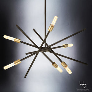 Showcasing a striking starburst design, the Urban Ambiance UHP2072 Modern Industrial Chandelier from the Miami Collection features an Olde Bronze finish and six exposed bulbs, creating a contemporary focal point against a gradient background.