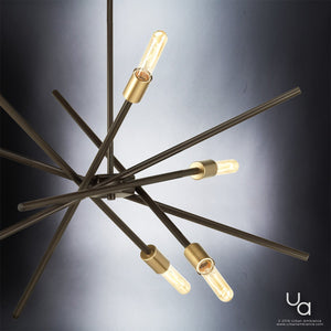 The Urban Ambiance UHP2072 Modern Industrial Chandelier from the Miami Collection, featuring an Olde Bronze finish and a striking starburst design, is displayed against a gradient background to showcase its contemporary aesthetic.