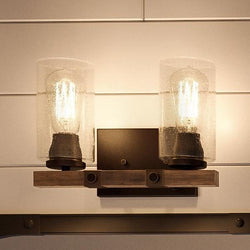 Two luxury Urban Ambiance UHP2080 Vintage Bath Fixtures, 8"H x 13-3/8"W, Olde Bronze Finish, Darlington Collection hanging on a wall in a