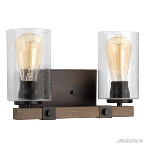 The Urban Ambiance UHP2080 Vintage Bath Fixture from the Darlington Collection features two exposed bulbs with clear cylindrical glass shades and an Olde Bronze finish, bringing a modern farmhouse touch to your space. This 8-inch high by 13-3/8-inch wide wall sconce blends dark metal accents with classic style.