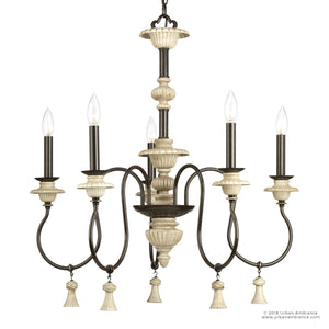 Experience French-inspired rustic elegance with the UHP2102 French Rustic Chandelier from Urban Ambiance’s Alicante Collection. Featuring an ancient bronze finish, gracefully curved arms, candle-style bulbs, and decorative tassels, this 27.875”H x 26”W farmhouse chandelier brings timeless charm to any space.