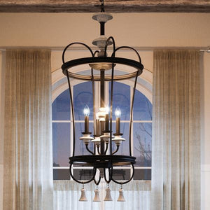 An Urban Ambiance UHP2103 French Country Chandelier, 42.125"H x 18.75"W, Ancient Bronze Finish, Alicante Collection hanging uniquely over a window in a beautiful