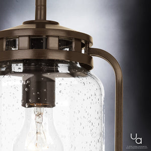 Close-up of the Urban Ambiance UHP2111 Nautical Pendant Light from the Carlsbad Collection, measuring 12″ high by 7.75″ wide in an Olde Bronze finish, featuring a clear seeded glass shade with bubble texture and a visible bulb inside.