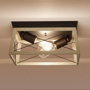 A luxury Industrial Chic flush-mount ceiling fixture with a light bulb in it.