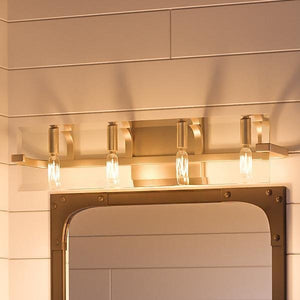 The Urban Ambiance UHP2135 Contemporary Bathroom Vanity Light from the Sevilla Collection, featuring a brushed bronze finish and measuring 6.38″ high by 30″ wide, is mounted above a rectangular mirror on a white paneled wall.