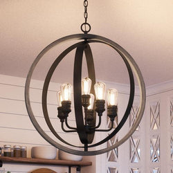 An UHP2210 Vintage Chandelier, a unique lighting fixture, 30-3/4"H x 28"W, Charcoal Finish from Urban Ambiance hanging over a kitchen island.
