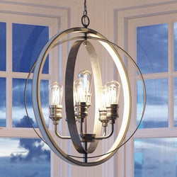 A gorgeous Urban Ambiance UHP2211 Vintage Chandelier, 30-3/4"H x 28"W, Galvanized Steel Finish from the Anchorage Collection hanging over a window in a