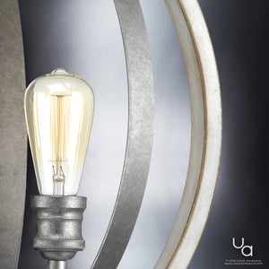 Close-up of a lit UHP2213 Vintage Chandelier from the Anchorage Collection, featuring metal and glass elements in a modern pendant light design with a galvanized steel finish, measuring 24″ high by 21-1/4″ wide. The Urban Ambiance logo appears in the bottom right corner.