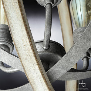 Close-up of the UHP2213 Vintage Chandelier from the Anchorage Collection by Urban Ambiance, featuring a 24-inch high by 21-1/4-inch wide design with a galvanized steel finish, highlighting its curved arms and exposed filament bulbs against a gradient background—ideal for introducing vintage-inspired lighting to any space.