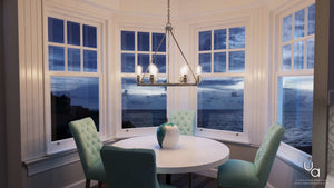 An Urban Ambiance dining room with a beautiful view of the ocean featuring the unique UHP2242 Industrial Chic Chandelier.