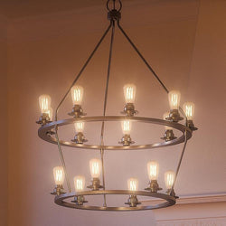 A unique lighting fixture, the UHP2246 Industrial Chandelier from the Nashville Collection by Urban Ambiance features a brushed nickel finish and numerous hanging light bulbs.