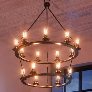 The Urban Ambiance UHP2247 XL Industrial Chandelier from the Nashville Collection, measuring 41-5/8″ by 36″ with a charcoal finish, hangs from a wooden ceiling near a window.