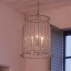 A beautiful UHP2255 Traditional Chandelier, 19-3/8" x 13-7/8", Antique Silver Finish from the Lexington Collection by Urban Ambiance hanging over a window