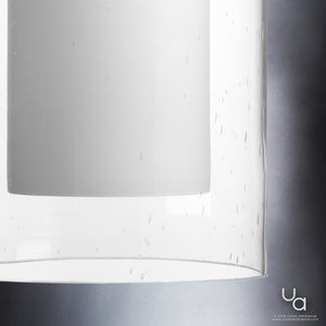 A beautiful pendant light fixture with a white shade and contemporary design.