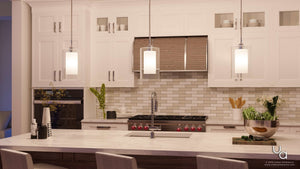 A kitchen with beautiful white cabinets and gorgeous marble countertops, featuring the UHP2262 Contemporary Pendant Light from Urban Ambiance's Memphis Collection, with a polished chrome finish, measuring 13.5