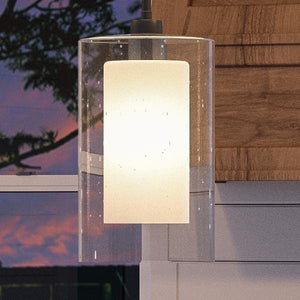 A beautiful Urban Ambiance UHP2263 Contemporary Pendant Light, 13.5"H x 7.75"W, hanging over a kitchen counter.