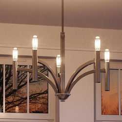 A gorgeous UHP2274 luxury lighting fixture, Polished Nickel Finish, Bradford Collection hangs above a window.
