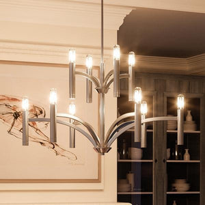 A beautiful UHP2276 Modern Chandelier from Urban Ambiance hanging over a dining room table.